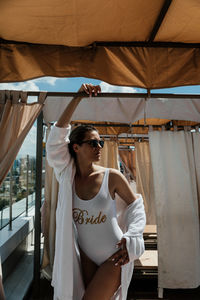 Young woman bride swimsuit