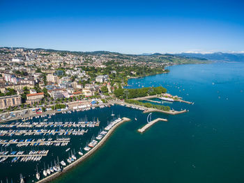 High angle view of townscape by sea