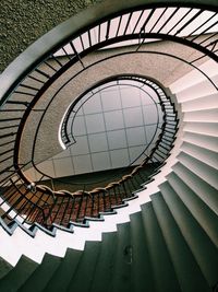 Directly below view of spiral staircase in building