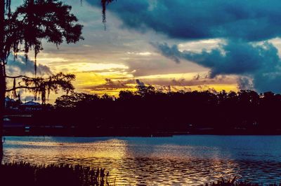 Scenic view of lake against sky during sunset