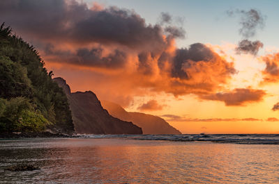 Sunset lights the receding cliffs of the napali coastline on north coast of kauai in hawaii