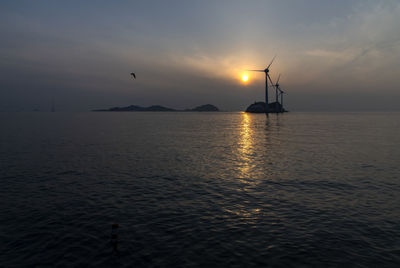 Scenic view of sea against sky during sunset