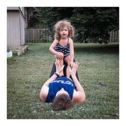 Portrait of a smiling girl sitting on grass