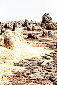 Rock formations on landscape against clear sky