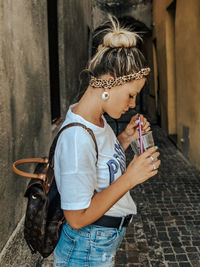 Young woman drinking wine in cafe