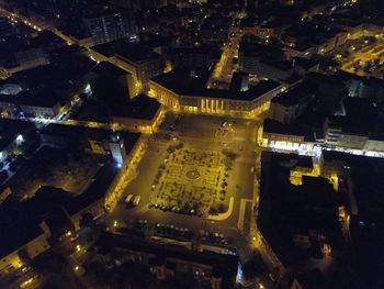High angle view of illuminated buildings in city at night