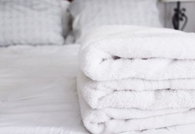 Close-up of towels on bed
