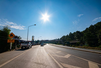 Cars on road against sky