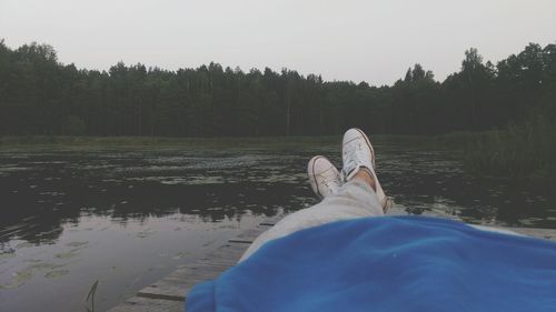 Low section of woman in water