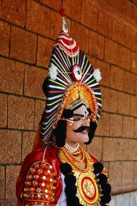 Low angle view of statue against wall