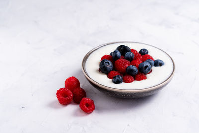 High angle view of strawberries in bowl on table