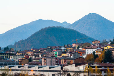 High angle view of houses in town against mountains