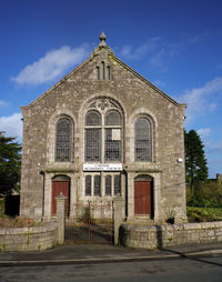 Facade of historic building against sky