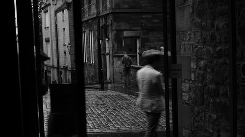 Rear view of man in corridor