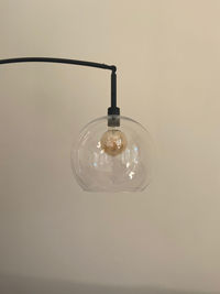 Close-up of light bulb hanging from ceiling