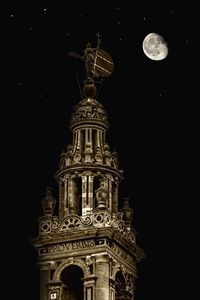 Low angle view of historical building against sky at night