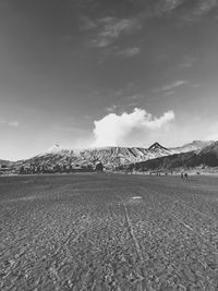 People on landscape against mountains