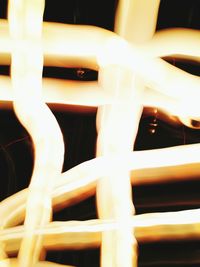 Low angle view of illuminated lighting equipment