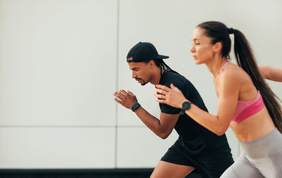 Young woman exercising in gym