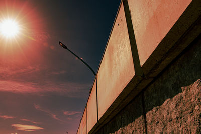 Low angle view of building against sky during sunset