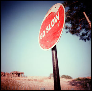 Close-up of road sign against clear sky