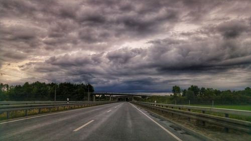 Storm clouds over road