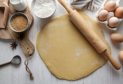 Dough recipe ingredients on white rural wood kitchen table