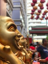 Statue of buddha against building