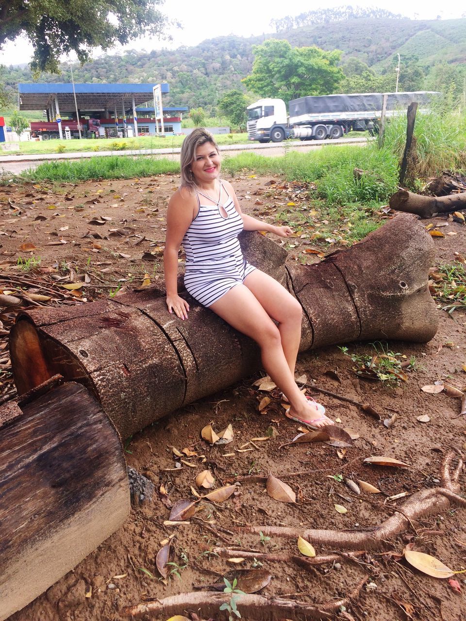 sitting, one person, full length, leisure activity, young adult, outdoors, only women, one woman only, beautiful woman, real people, adults only, portrait, people, young women, day, adult