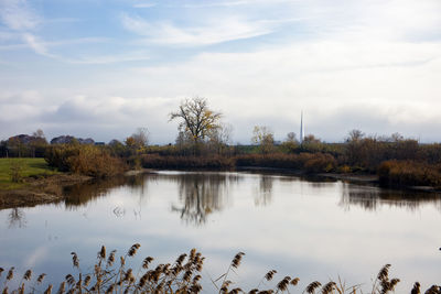  lakes of falchera, district of turin in italy, with tree in the center seen from the opposite shore