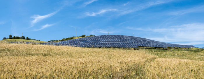 Panoramic view of field against sky