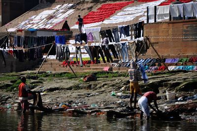 Group of people fishing in water