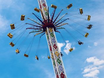 Low angle view of ferris wheel against sky