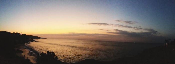 Scenic view of calm sea at sunset