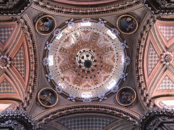 Low angle view of ornate ceiling of building