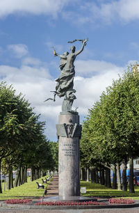 Low angle view of statue against sky