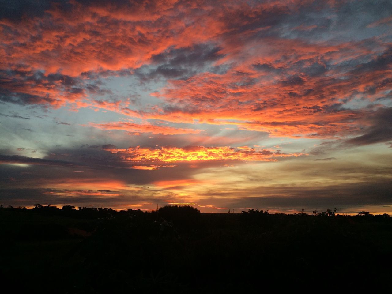 sunset, silhouette, sky, scenics, beauty in nature, tranquil scene, orange color, tranquility, cloud - sky, dramatic sky, idyllic, nature, landscape, cloudy, cloud, moody sky, dark, majestic, atmospheric mood, outdoors