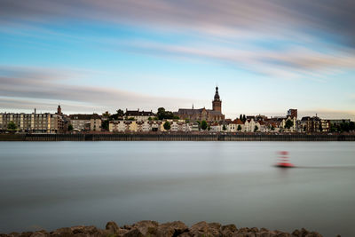 River by city against sky