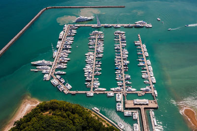 Yachts and boats in marina bay at phuket thailand aerial view