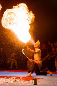 High angle view of men burning at night