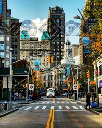 City street and buildings against sky