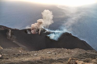 Smoke emitting from volcanic mountain