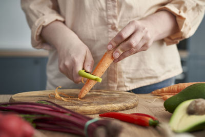 Midsection of woman preparing food