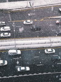 High angle view of road marking on street during rainy season