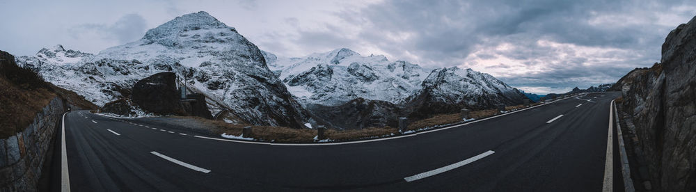 Panoramic view of road amidst mountains against sky