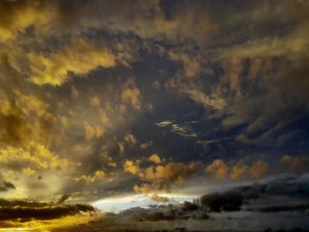 Low angle view of dramatic sky during sunset