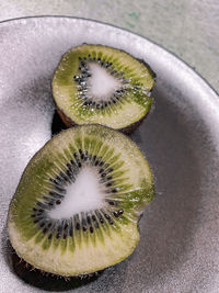 High angle view of kiwi on table