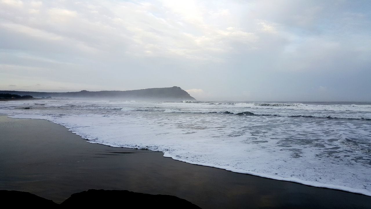 sea, beach, water, horizon over water, shore, scenics, tranquil scene, sky, beauty in nature, tranquility, sand, wave, nature, surf, idyllic, coastline, cloud - sky, calm, outdoors, remote