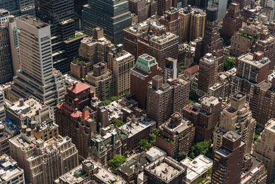 Top view of the streets of manhattan with trees and brick houses