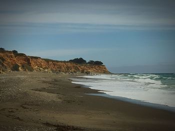 Scenic view of beach against sky